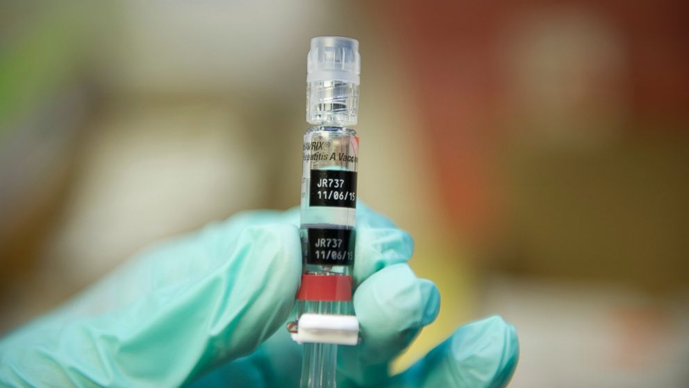 A nurse loads a syringe at a free immunization clinic for students before the start of the school year in Lynwood, Calif. Aug. 27, 2013.  