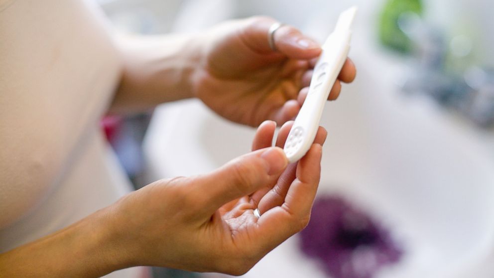 PHOTO: In this stock image, a woman is seen with a pregnancy test. 