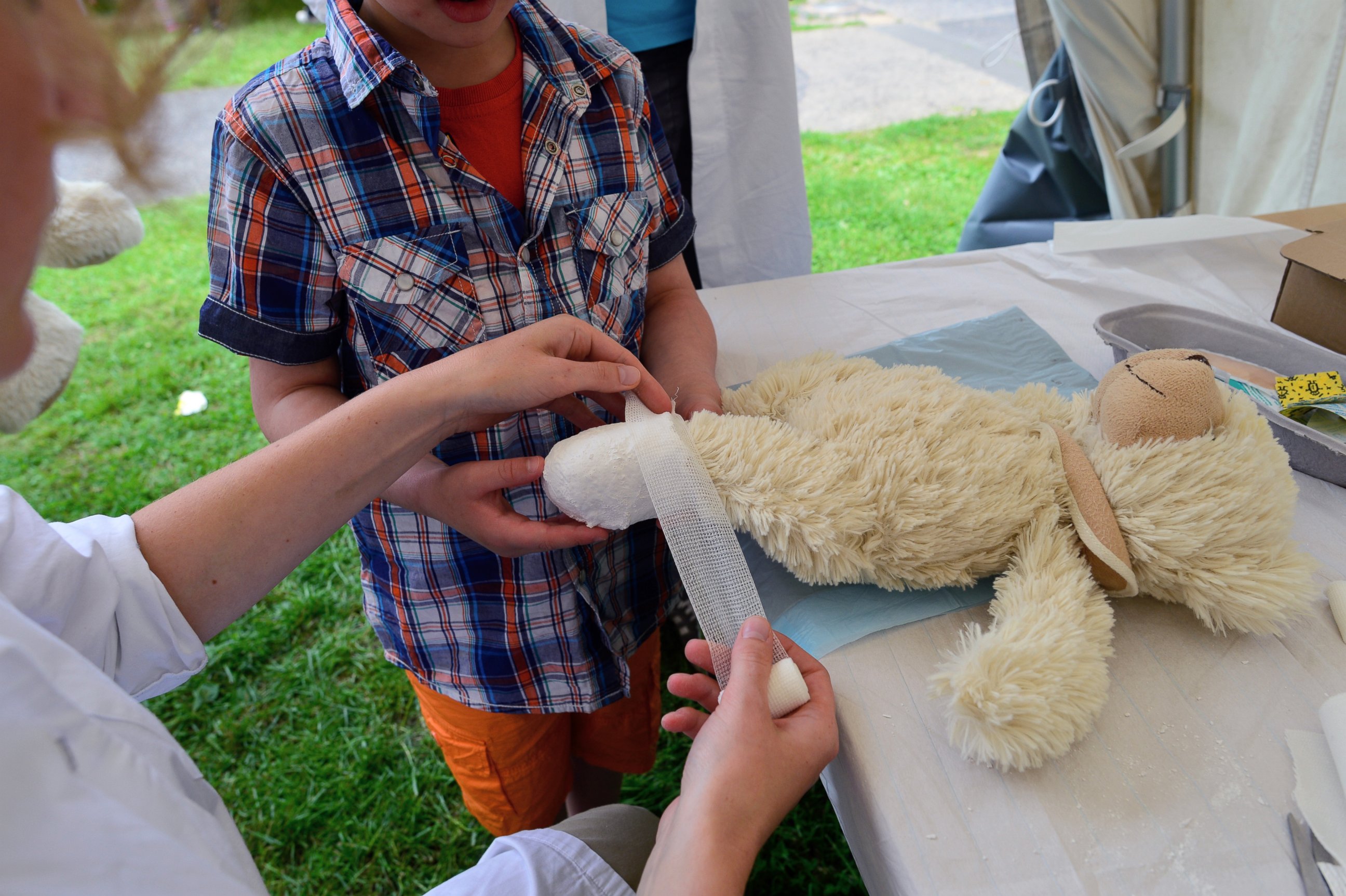 PHOTO: A teddy bear that belongs to a young boy gets a bandage at the "Teddy Clinic'' on June 4, 2014 in Giessen, Germany. 