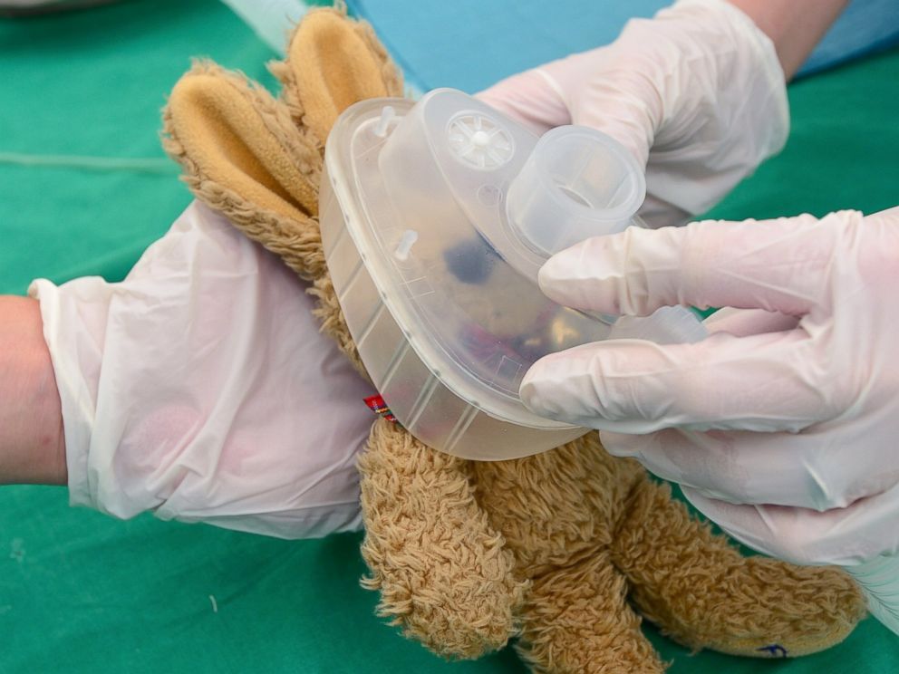 PHOTO: Medical students prepare the operation for Bens, age 3, teddy bear Felix in the operating room of the Teddy Clinic on June 4, 2014 in Giessen, Germany.