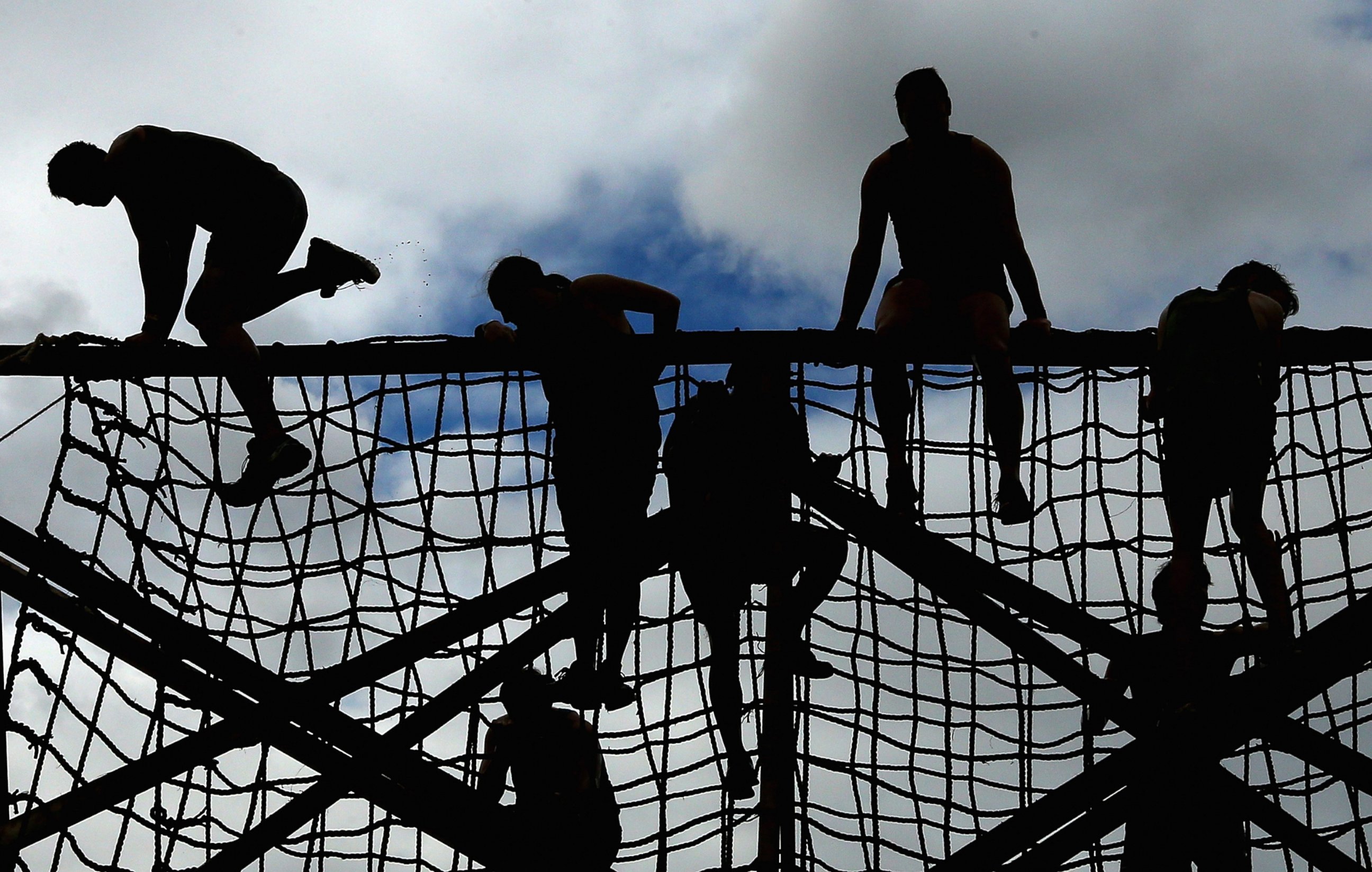 PHOTO: Competitors climb up a rope net during Toughmudder at Phillip Island Grand Prix Circuit, March 23, 2014 in Phillip Island, Australia.