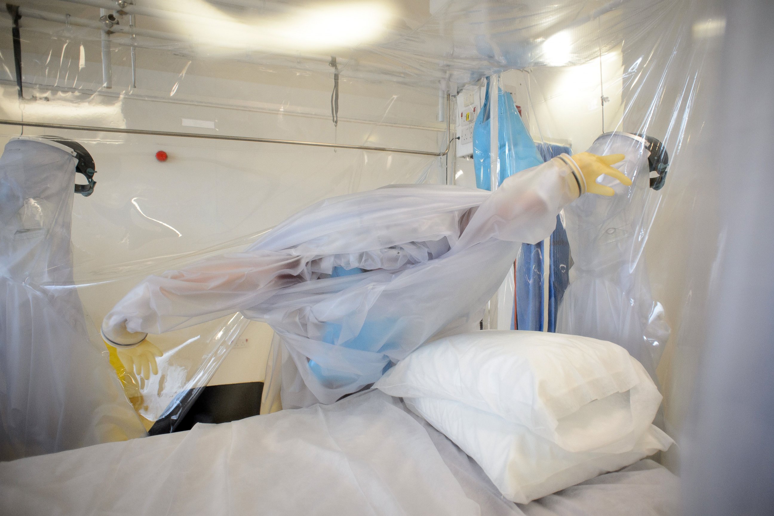 PHOTO: A nurse wears protective clothing as he demonstrates the facilities in place at the Royal Free Hospital in north London, Aug. 6, 2014, in preparation for a patient testing positive for the Ebola virus.