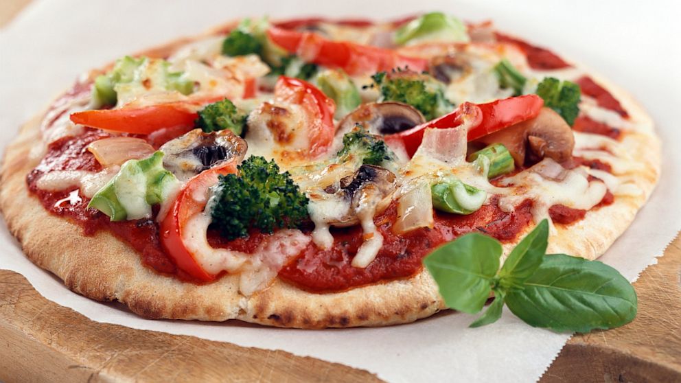 At-home diners can save 126 calories by swapping out takeout pizza for homemade veggie pizza.