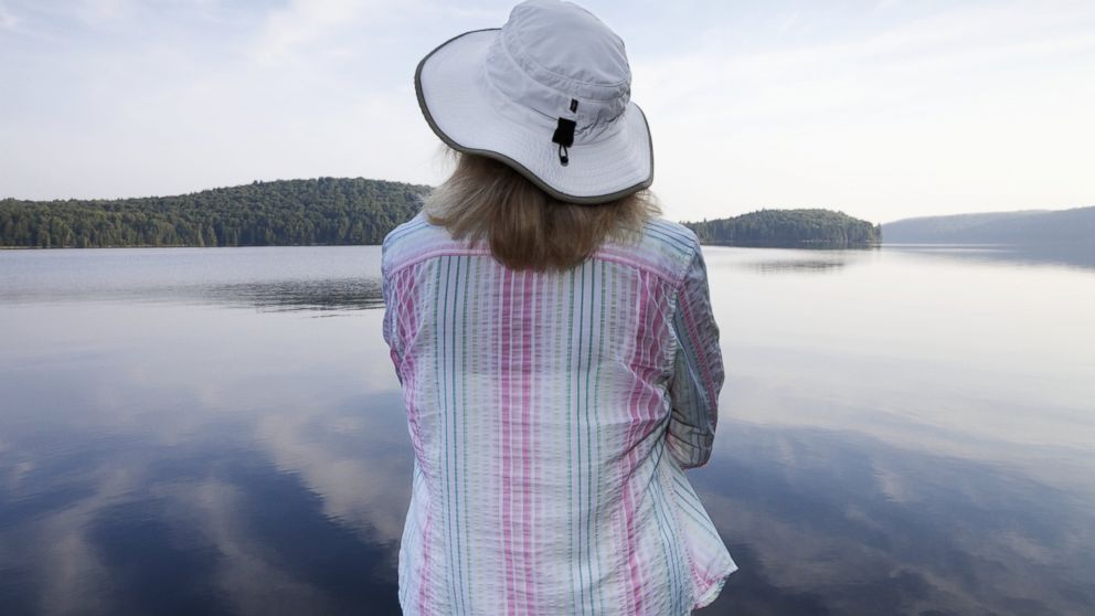 A woman wearing a hat is pictured in this stock photo. 