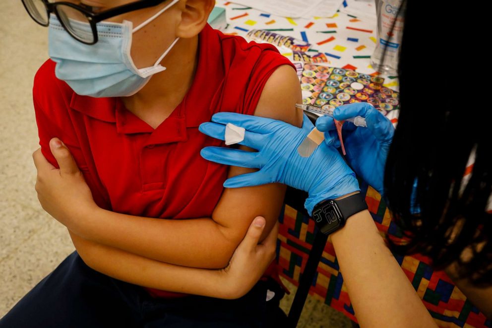 PHOTO: A child receives a dose of the Pfizer-BioNTech COVID-19 vaccine at an elementary school vaccination site for children ages 5 to 11-year-old in Miami, Nov. 22, 2021.