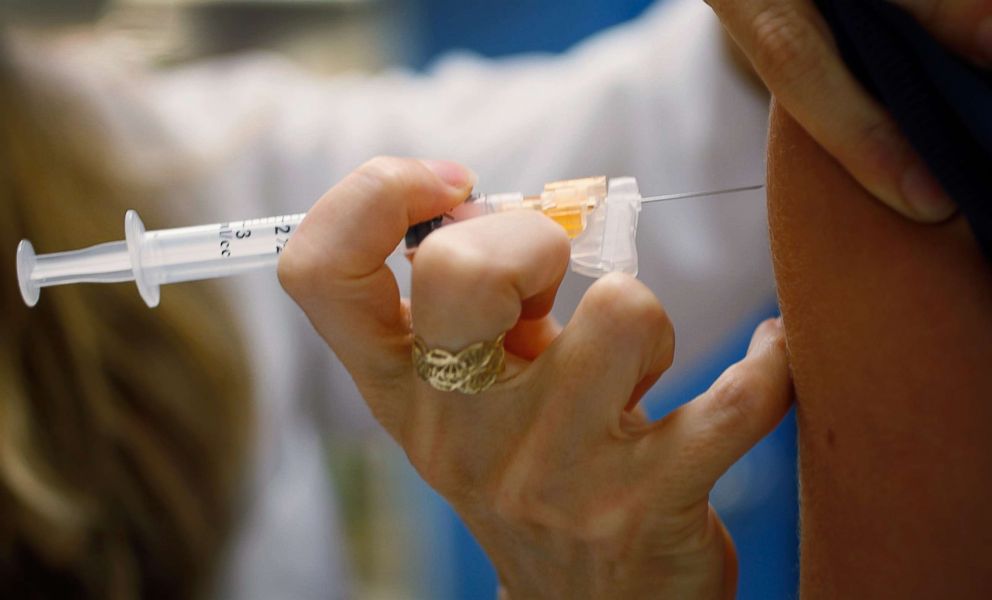 PHOTO: A pediatrician gives an HPV vaccination to a 13-year-old girl in her office, Sept. 21, 2011, in Miami, Florida. 