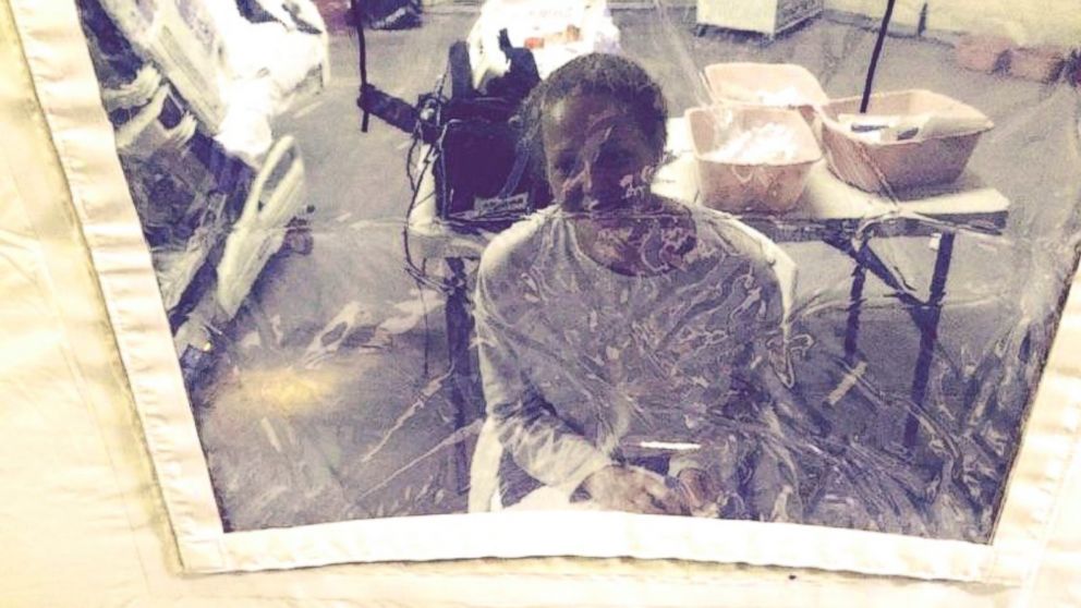 Kaci Hickox is seen sitting inside the isolation tent she has been housed in at University Hospital in Newark, New Jersey.