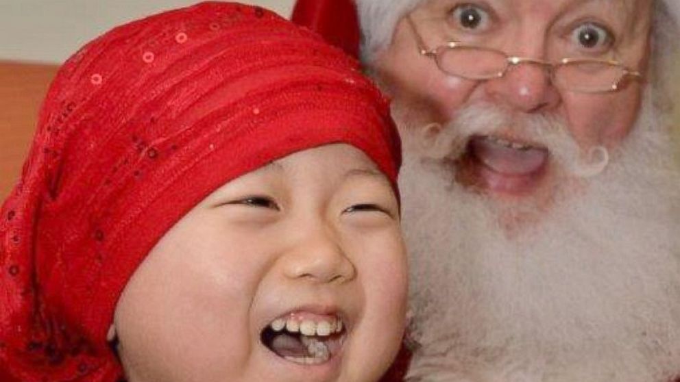 PHOTO: Santa and this little girl at the Jimmy Fund Clinic were competing for biggest smile.