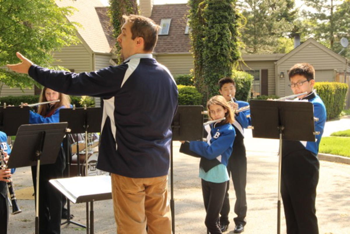 PHOTO: Members of the Northbrook Junior High School Wind Ensemble in Northbrook, Ill., brought their school concert to the front yard of a bandmate's home.