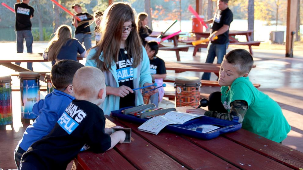 Campers enjoy activities like music and canoeing at Camp Painless But Hopeful 