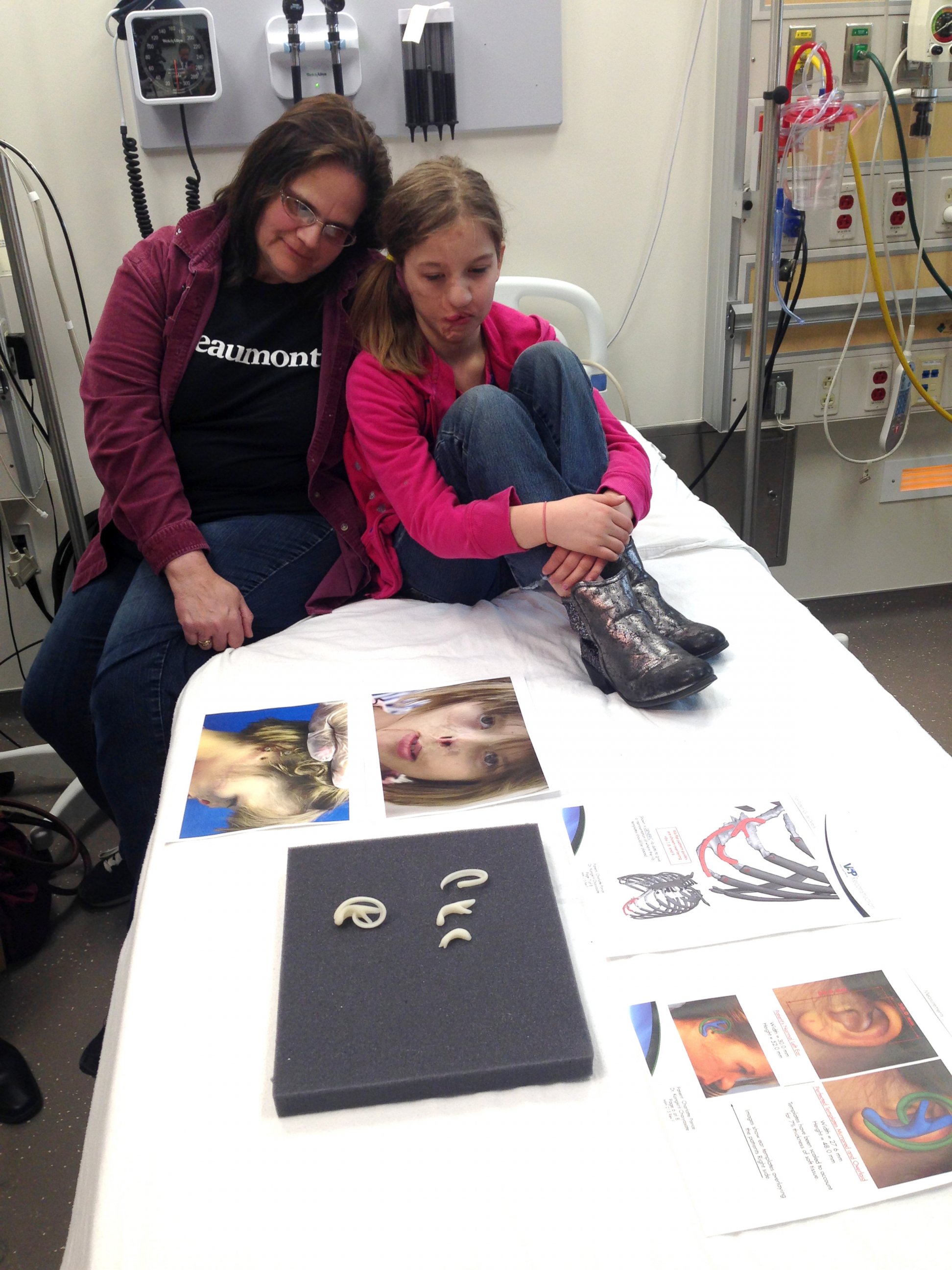 PHOTO: Charlotte Ponce with her mother before surgery to create a new ear at Beaumont Children’s Hospital in Michigan.