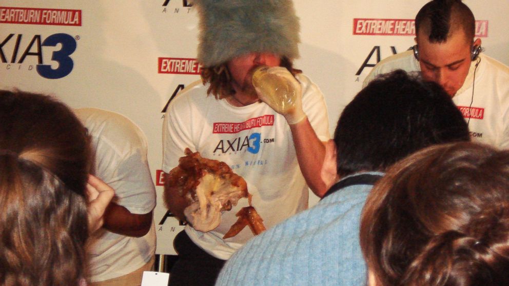 Competitive eater Crazy Legs Conti attempting to eat 9 pounds of turkey in 12 minutes.