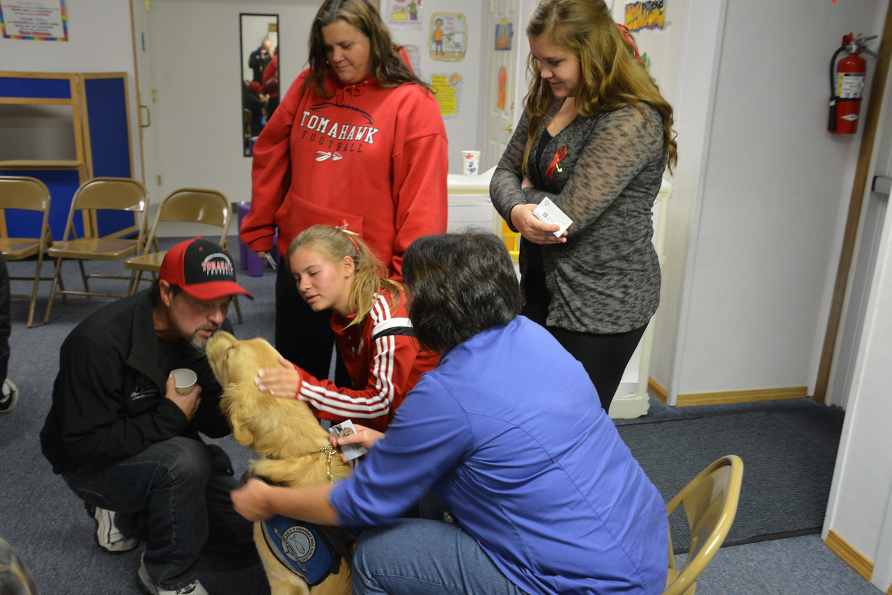 PHOTO: Residents hugged the golden retrievers at a church gathering Monday night.