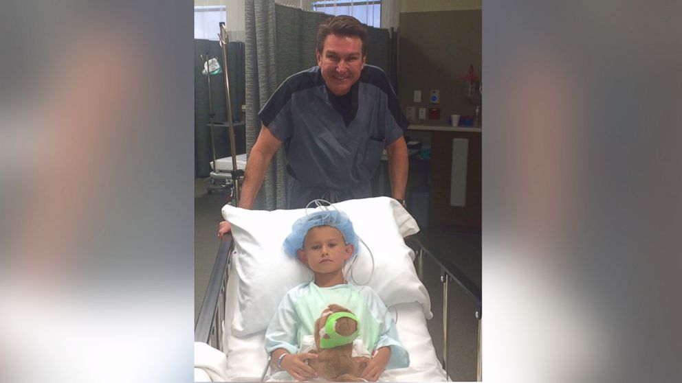 Gage Berger, 6, is pictured here before getting ear pinning surgery in Salt Lake City, Utah, done by Dr. Steven Mobley of the Mobley Founation for Charitable Surgery. 