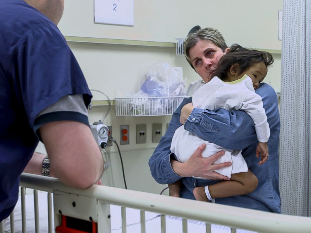 PHOTO: Johanne Wagner cares for her daughter Phuoc just before she undergoes a liver transplant