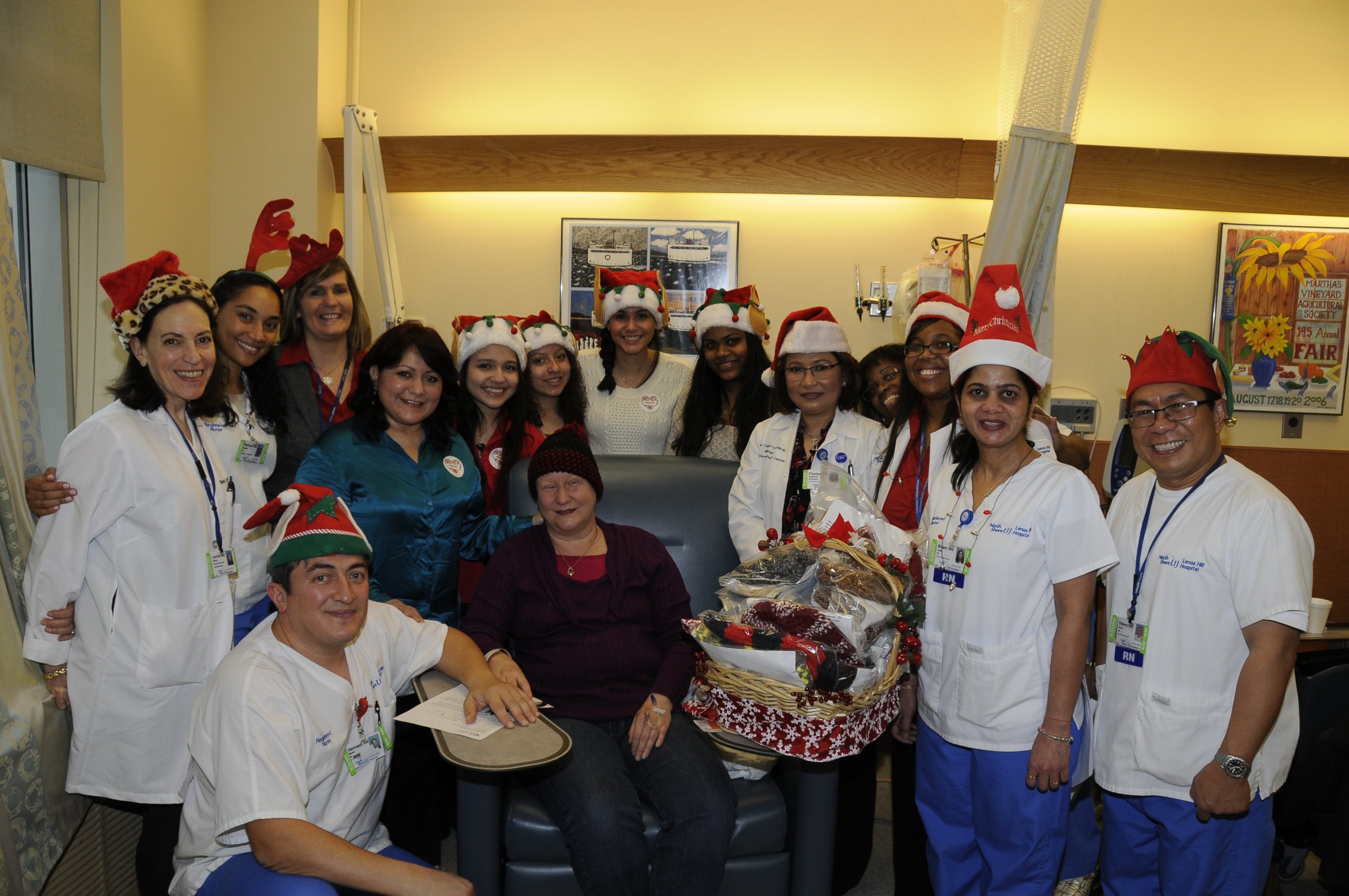 PHOTO: Susana Luna, her daughter and the Lenox Hill Hospital Radiation Department staff sang Christmas songs for patients receiving knitted hats through the Madresita Project Monday, Dec. 22. 