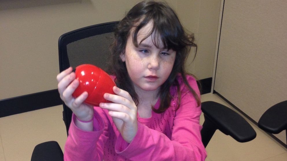 Rachel Hyche, 10, holds a beeping Easter egg.