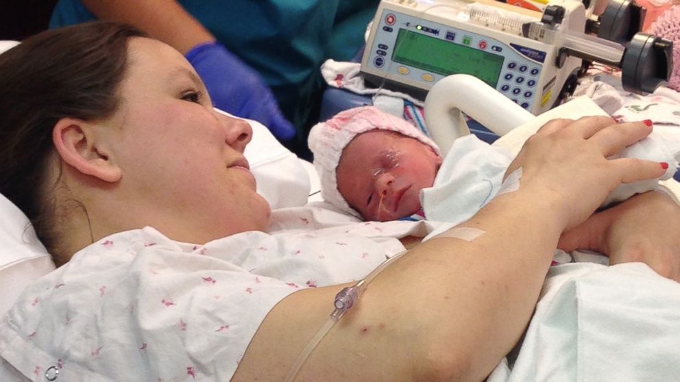Sarah Thistlewaite holds her daughter Jillian after her birth. 
