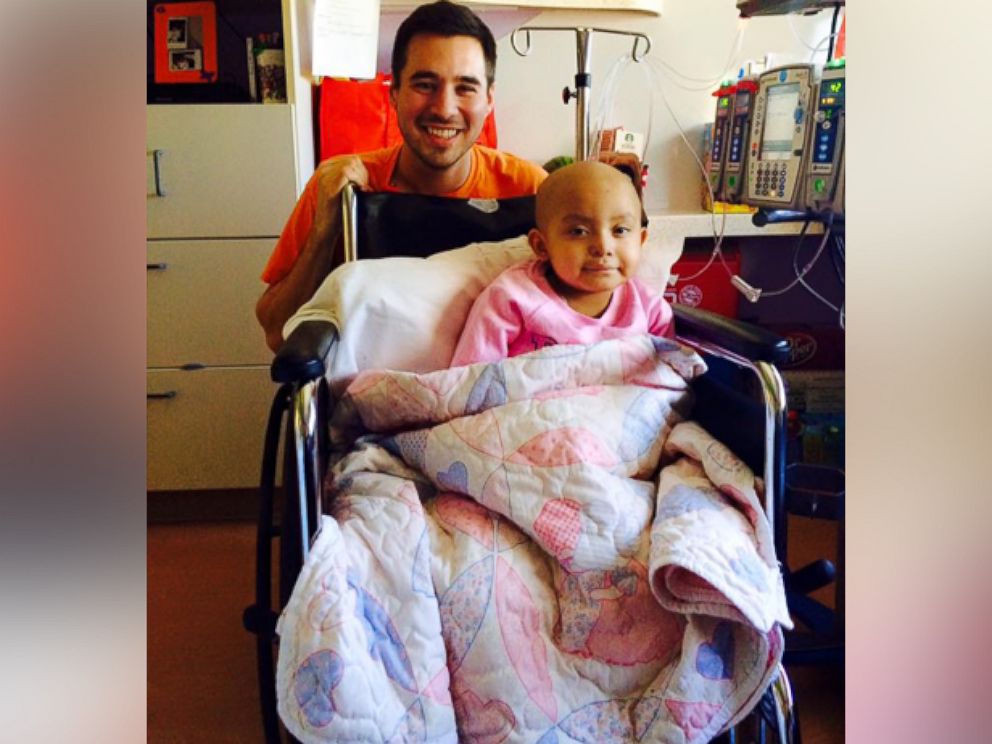 PHOTO:Brandon Waterhouse, a nurse at Texas Children's Hospital, sings Disney songs to 4-year-old Leukemia patient Sophia Torres.  