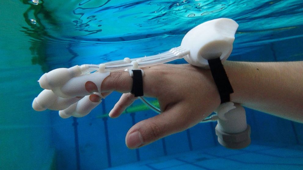 Researchers say this glove - shown here in a photo from its website - uses a combination of sonar technology and water jets that can help users find objects underwater. 