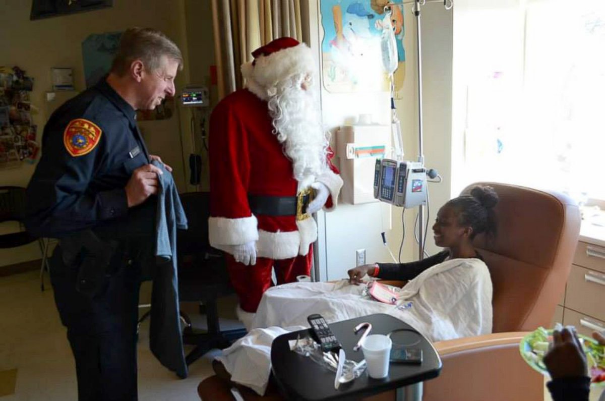 PHOTO: Sick kids get a visit from Santa and a member of the police force at Stony Brook Children's Hospital.