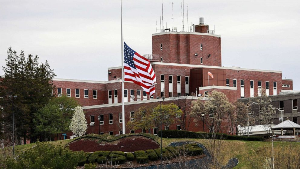PHOTO: An American flag flies at half-mast outside the Holyoke Soldiers' Home, April 29, 2020, in Holyoke, Mass.
