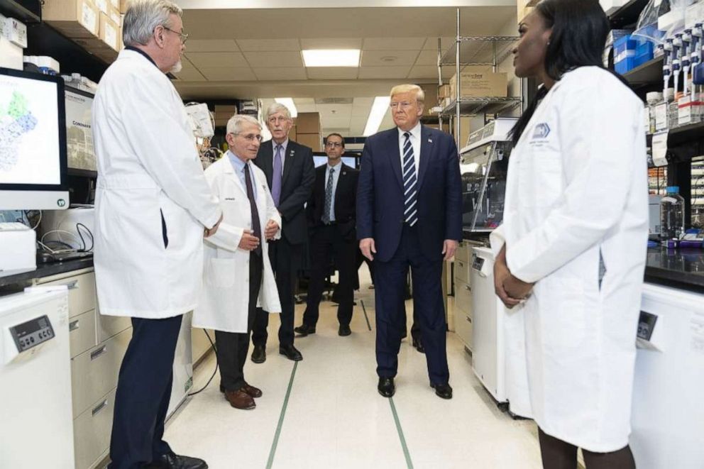 PHOTO: President Trump visits the biological lab, March 3, 2020, at the National Institutes of Health, with Dr. Anthony Fauci, 2nd-left, and Dr. Kizzmekia Corbett, right. 