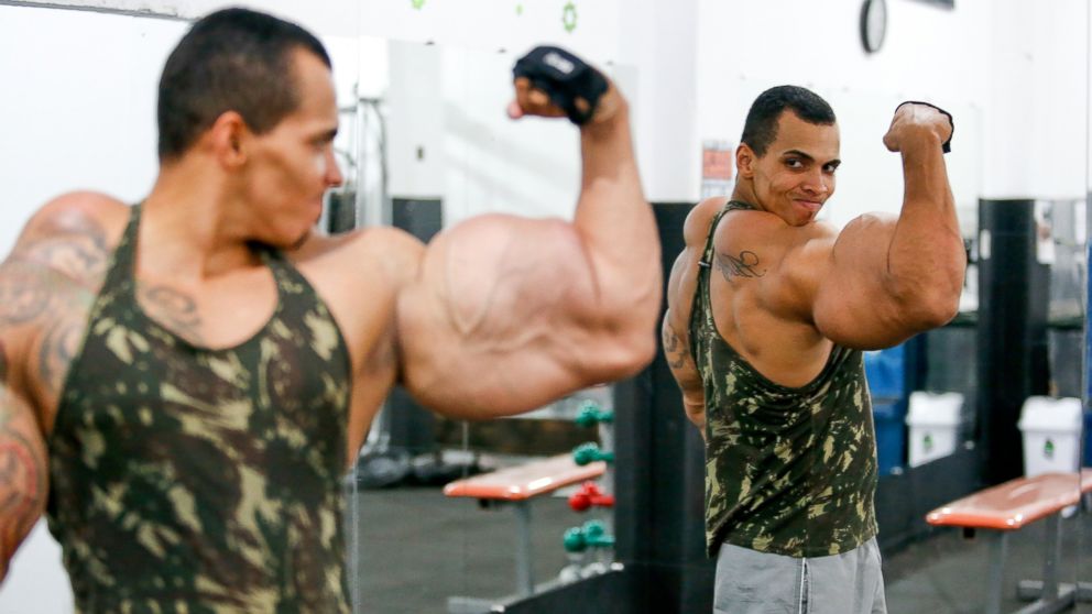 PHOTO: Romario dos Santos Alves, a bodybuilding enthusiast, works out his muscles in the gym, April 4, 2015, in Caldas Novas, Goias, Brazil.