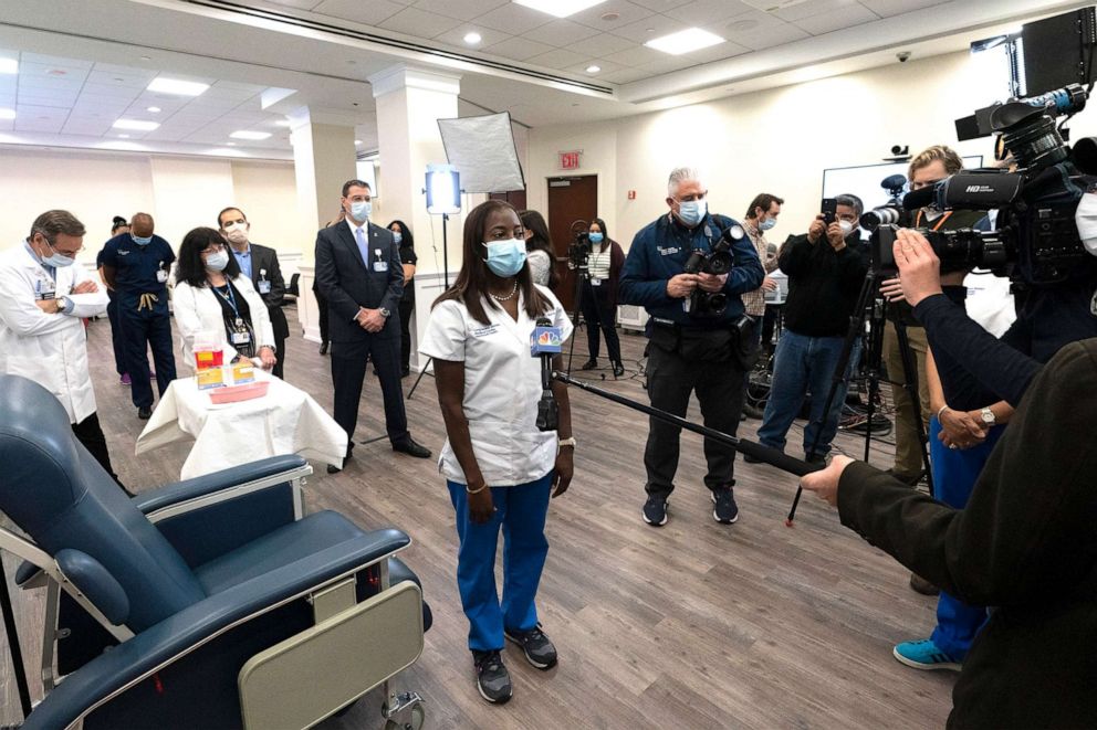PHOTO: Nurse Sandra Lindsay, center, gives an interview after she is inoculated with the COVID-19 vaccine, Dec. 14, 2020 at the  Jewish Medical Center, in Queens, New York.