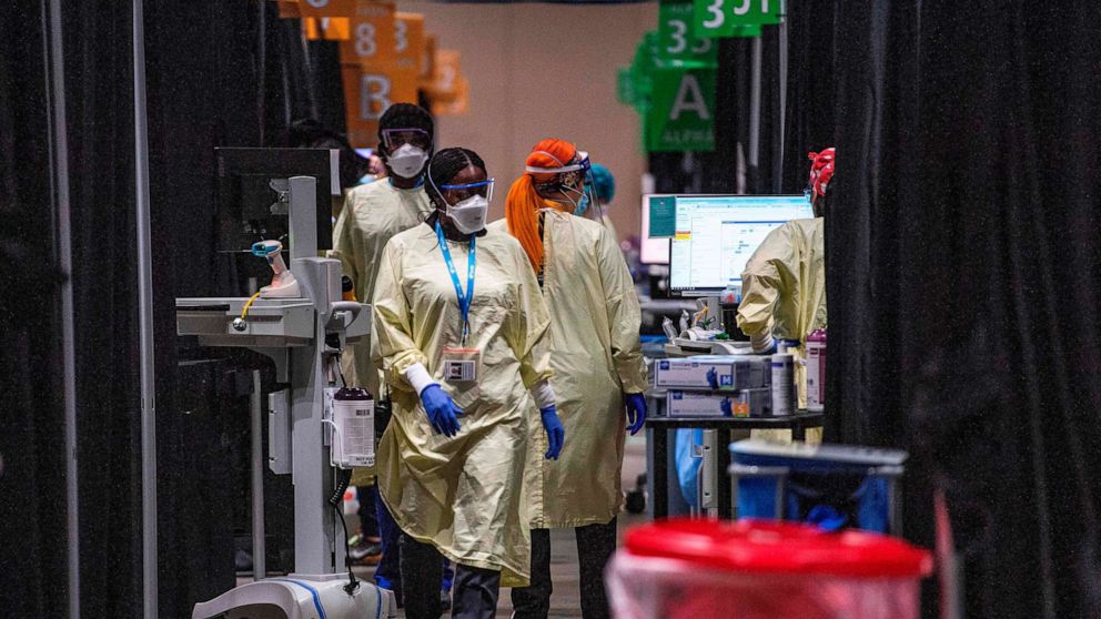 PHOTO: Inside the hot zone medical staff monitor and treat sick patients infected with the COVID-19 virus at the UMASS Memorial DCU Center Field Hospital in Worcester, Mass., January 13, 2021. 