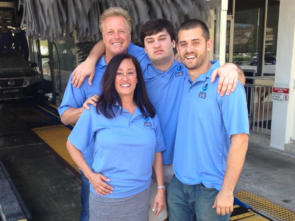 The D'Eri family poses for a photo at Rising Tide Car Wash