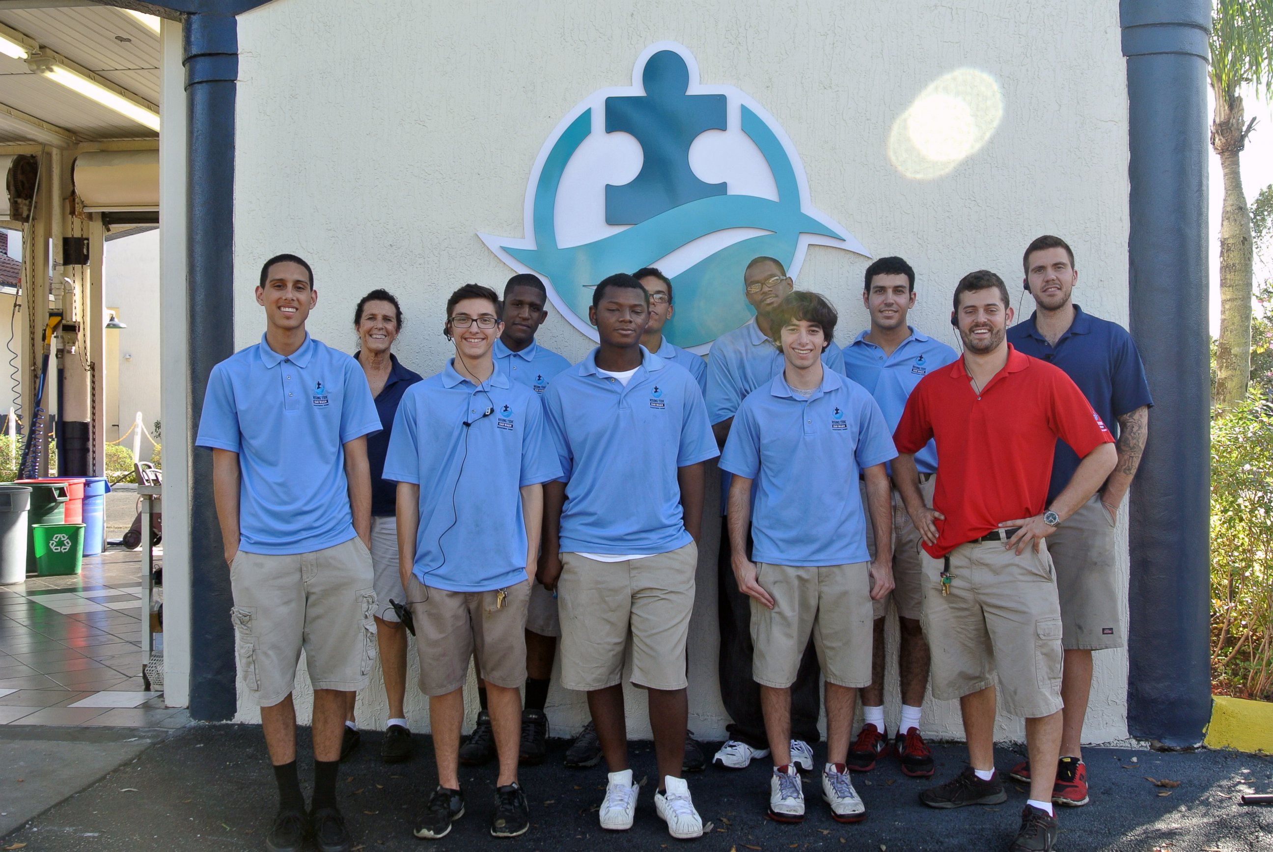 PHOTO: Employees of Rising Tide Car Wash pose for a photo.