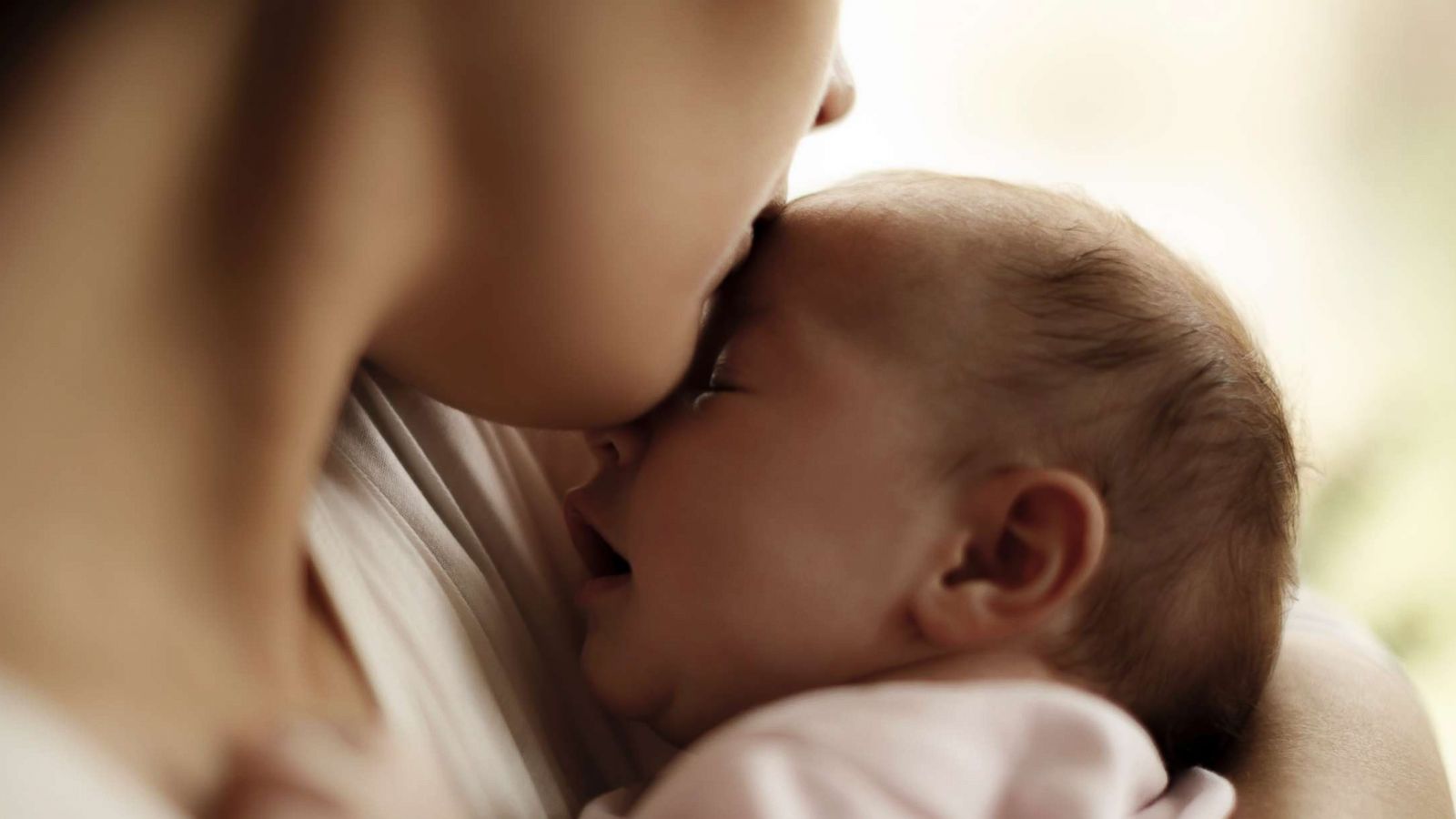 PHOTO: Mother and baby at home postpartum.