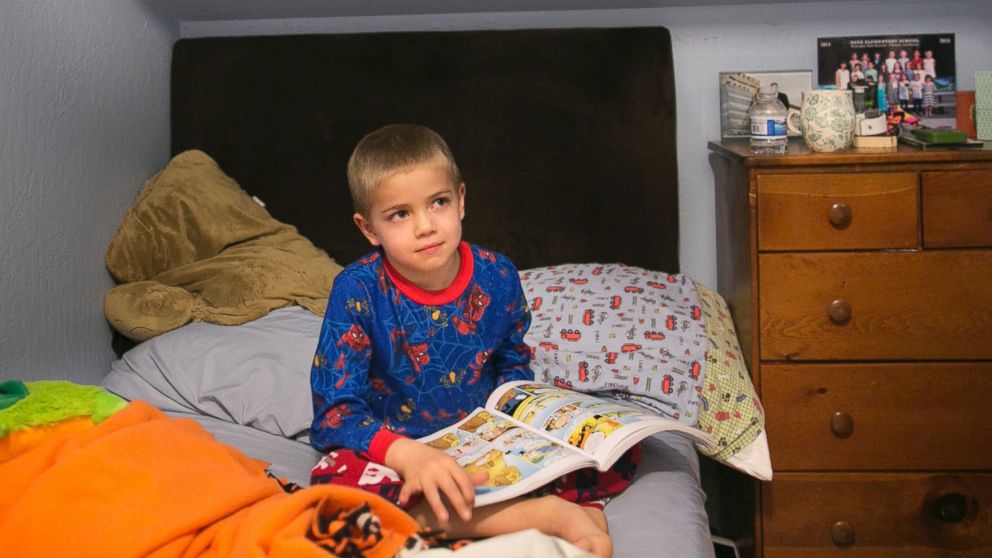 Rhett Krawitt sits on a bed in his home in Corte Madera, Calif. Jan. 28, 2015. 