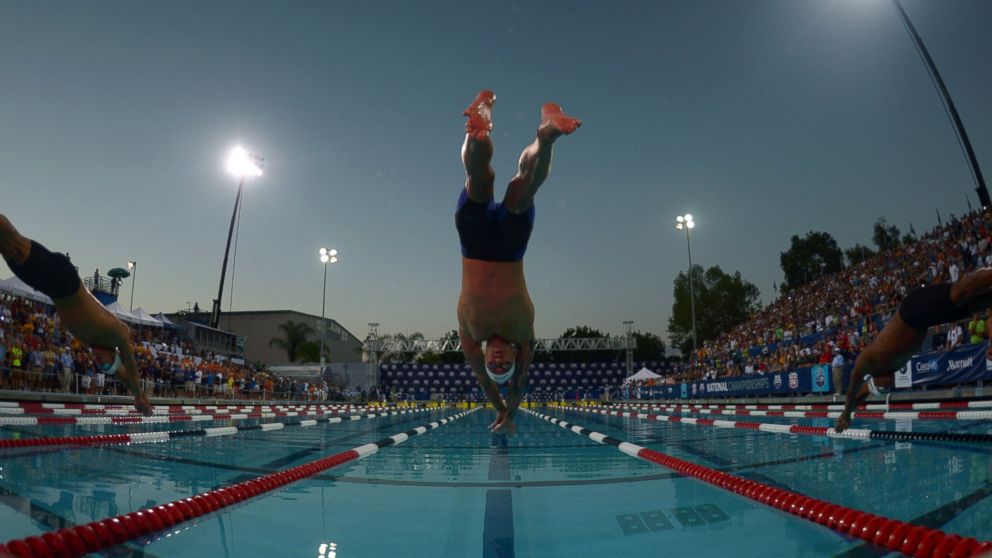 PHOTO: Anthony Ervin dives into the pool at the start of the 50m freestyle