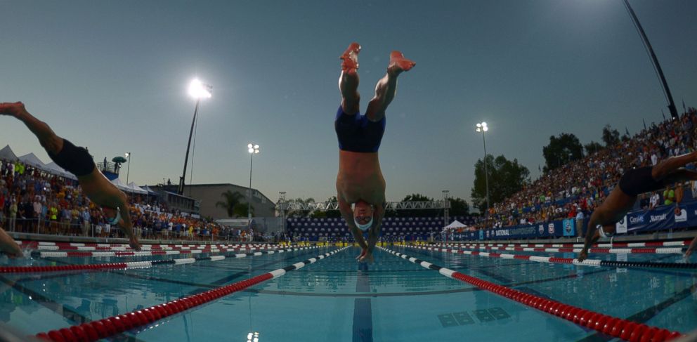 PHOTO: Anthony Ervin dives into the pool at the start of the 50m freestyle 