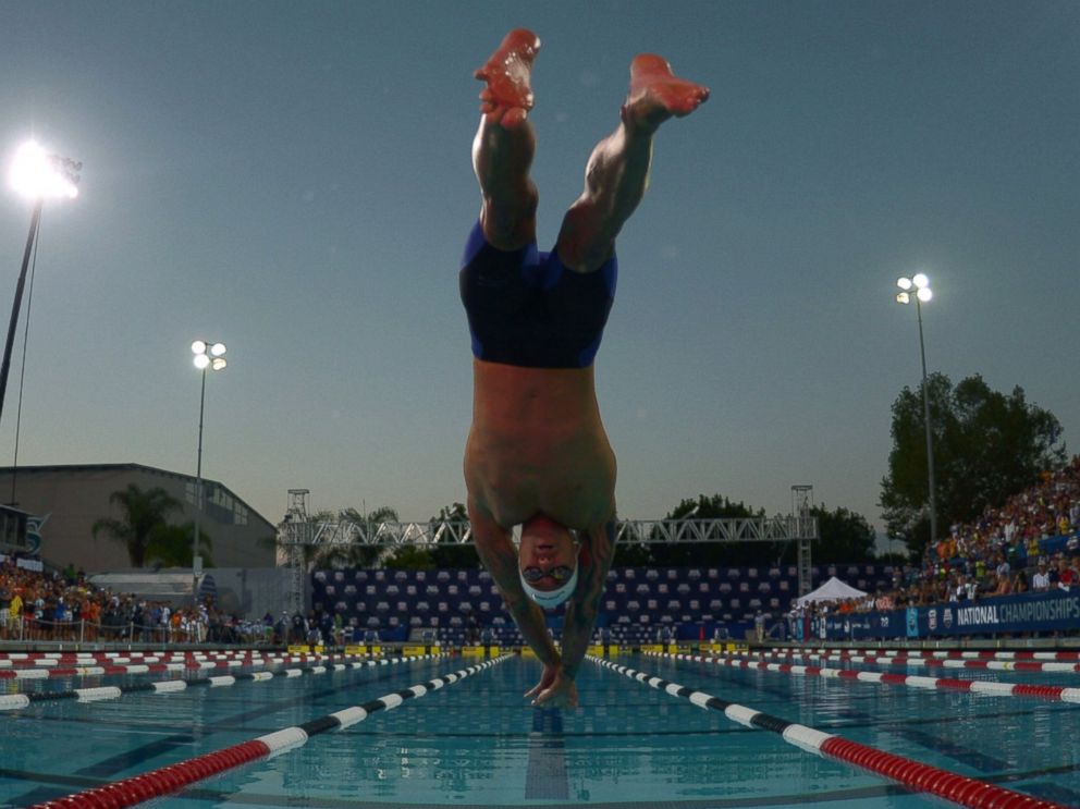 PHOTO: Anthony Ervin dives into the pool at the start of the 50m freestyle