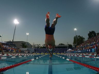 PHOTO: Anthony Ervin dives into the pool at the start of the 50m freestyle