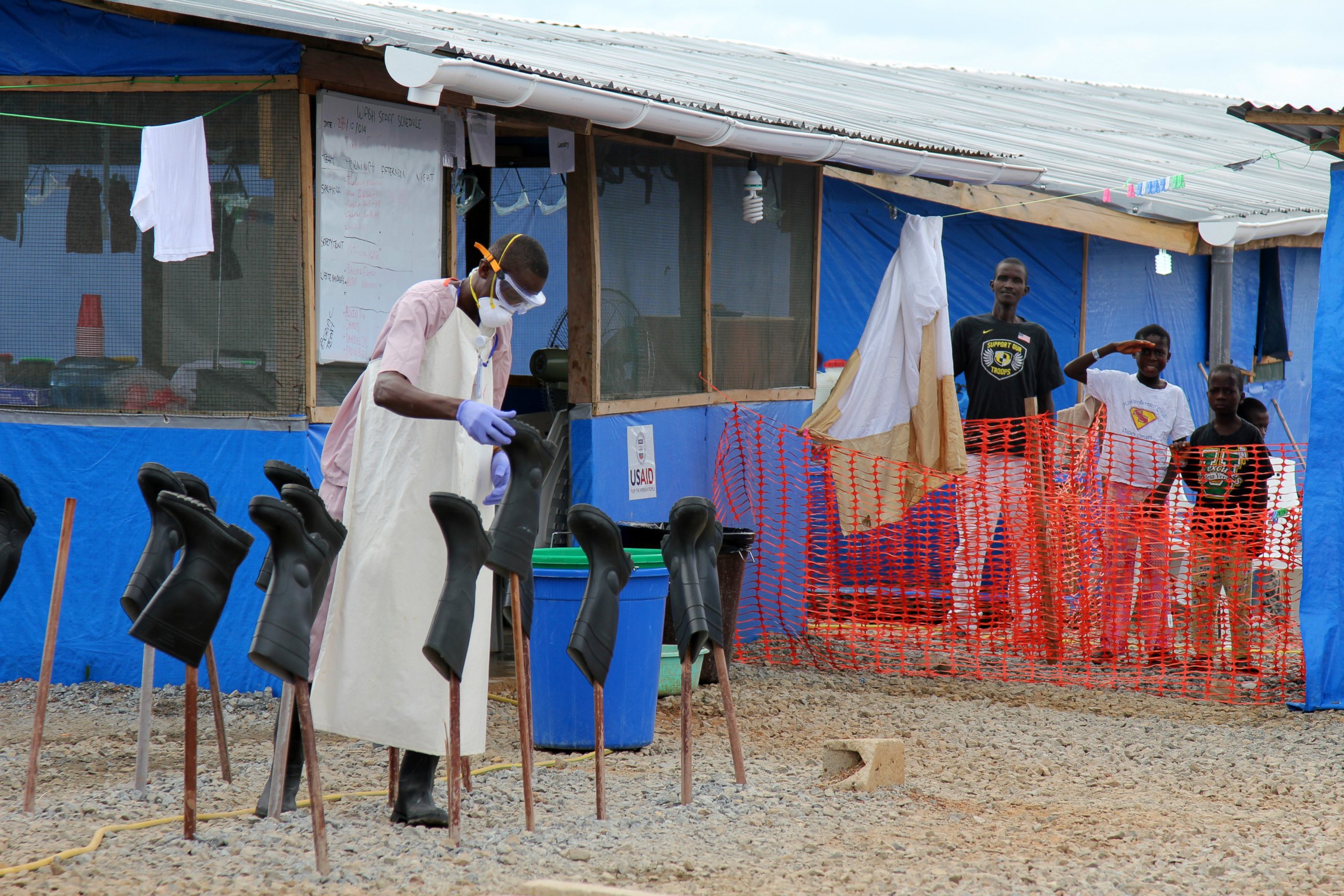 PHOTO: People stand in the "red zone" where they are being treated for Ebola at the Bong County Ebola Treatment Unit in Monrovia, Liberia, Oct. 28, 2014.