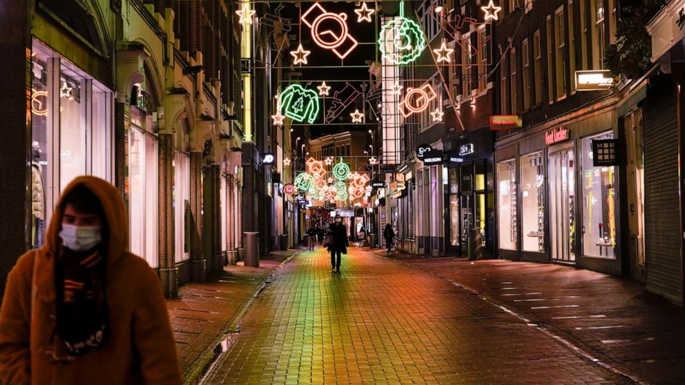 FILE - A view of the capital's shopping streets are near-empty after 5 pm in Amsterdam, Netherlands, Monday, Nov. 29, 2021, after a tougher COVID-19 related lockdown came into effect. The new Dutch government was meeting Thursday, Jan. 13, 2022, to d