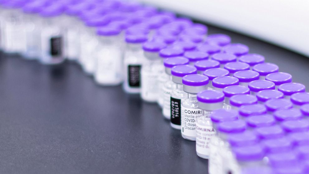 In this March 2021 photo provided by Pfizer, vials of the Pfizer-BioNTech COVID-19 vaccine are prepared for packaging at the company's facility in Puurs, Belgium. On Wednesday, Aug. 25, 2021, the company said it started the application process for U.