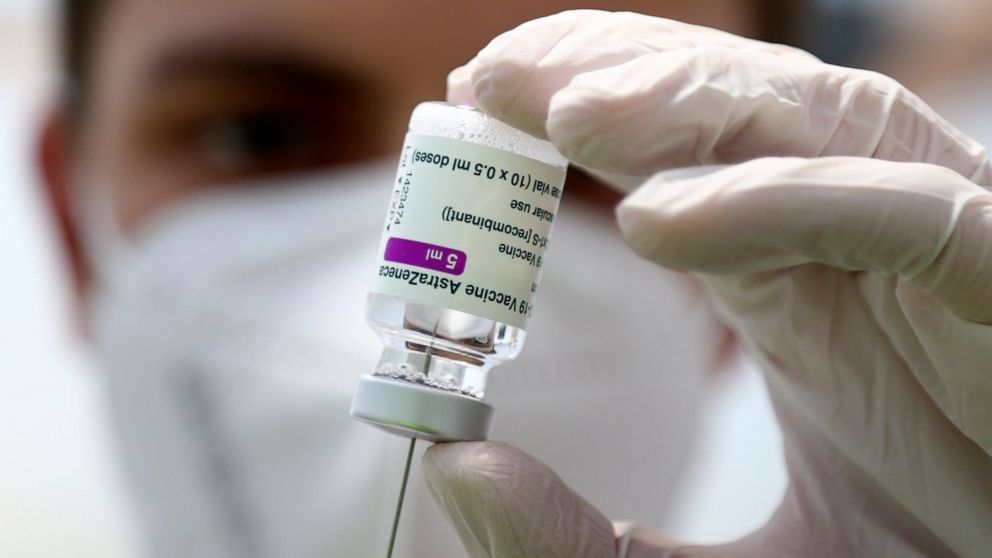 FILE - In this Monday, March 22, 2021 file photo, a member of the the medical staff prepares a syringe with the AstraZeneca coronavirus vaccine, during preparations at the vaccine center in Ebersberg near Munich, Germany. German officials have decide