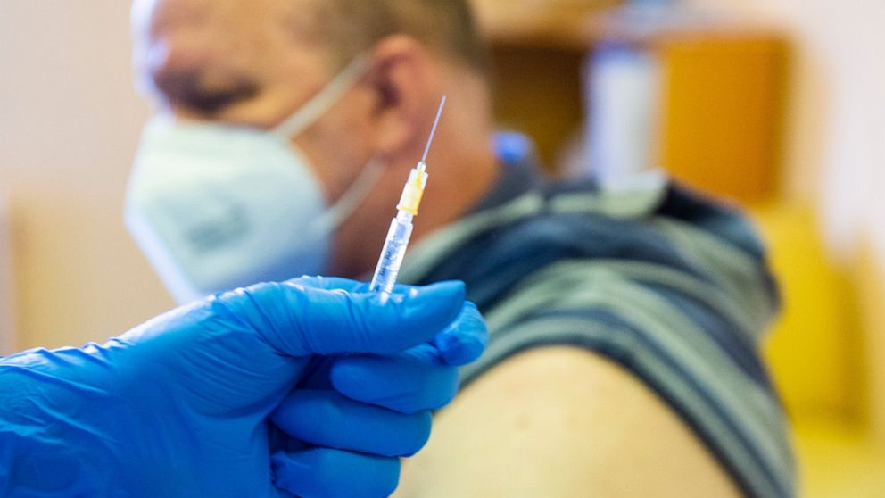 A man is administered the Sputnik V COVID-19 vaccine in Bratislava, Slovakia, Monday June 7, 2021. (Jakub Kotian/TASR via AP)