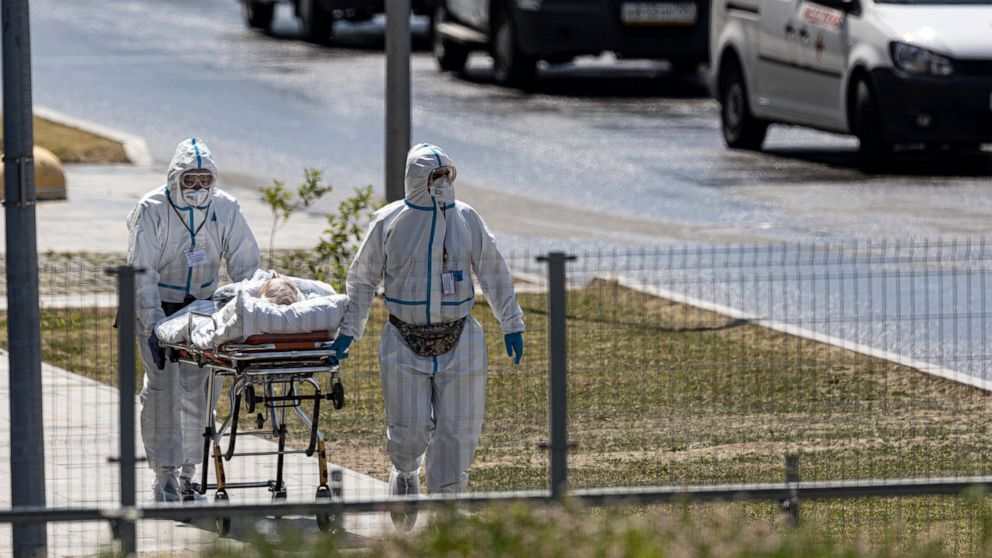 The Latest: Russia reports highest virus death toll of 2021
