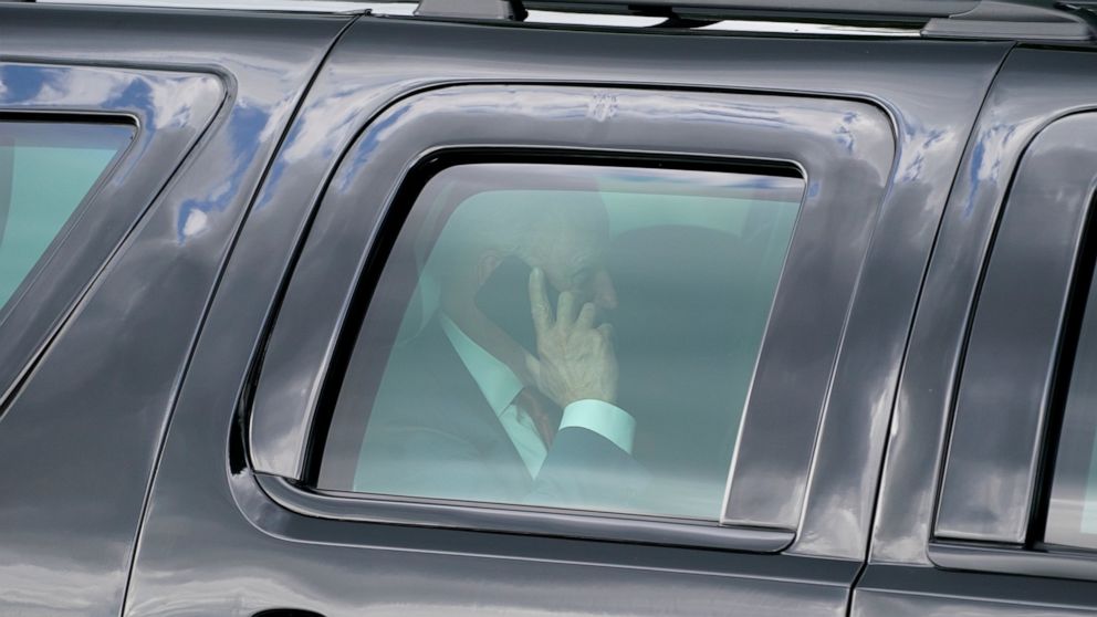 President Joe Biden speaks on his phone after he and first lady Jill Biden arrived on the Ellipse near the White House, Friday, June 4, 2021, in Washington. Biden returns to the White House after spending a few days in Rehoboth Beach to celebrate fir