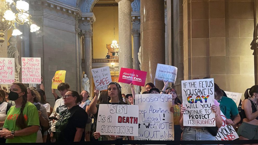 FILE - Abortion-rights protesters fill Indiana Statehouse corridors and cheer outside legislative chambers, Friday, Aug. 5, 2022, as lawmakers vote to concur on a near-total abortion ban, in Indianapolis. Critics of religious freedom laws often argue