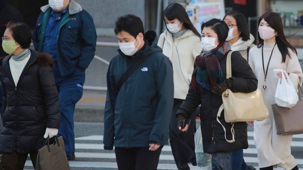 Japan widens virus emergency for 7 more areas as cases surge