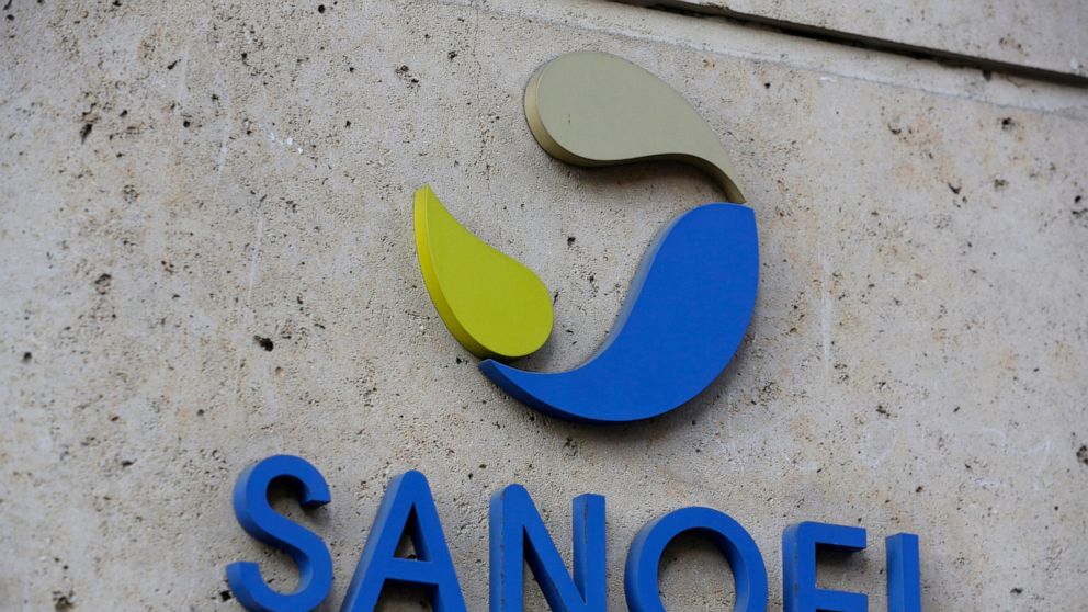 FILE - In this photo Nov.30, 2020 file photo the logo of French drug maker Sanofi is picture at the company's headquarters, in Paris. French drug maker Sanofi said Wednesday it will help manufacture 125 million doses of the coronavirus vaccine develo
