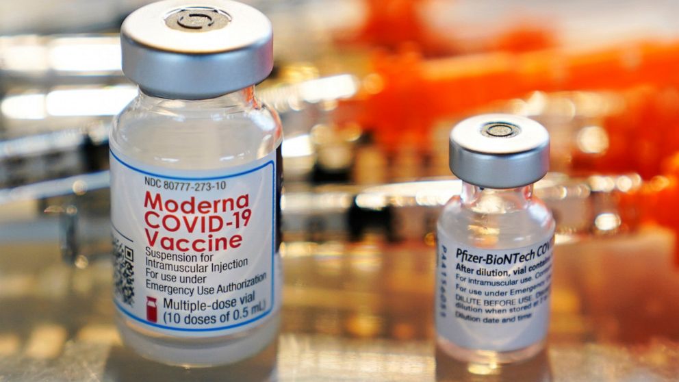 FILE - Vials for the Moderna and Pfizer COVID-19 vaccines are seen at a temporary clinic in Exeter, N.H. on Thursday, Feb. 25, 2021. The Food and Drug Administration has authorized another booster dose of the Pfizer or Moderna COVID-19 vaccine for pe