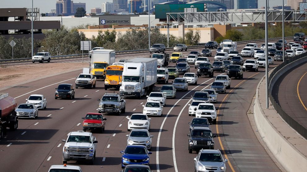 FILE - In this Jan. 24, 2020 file photo, early rush hour traffic rolls along I-10 in Phoenix. Traffic deaths in the U.S. fell for the third straight year in 2019, the government's road safety agency said Thursday, Oct. 1. The National Highway Traffic